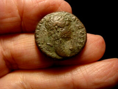 HADRIAN, 117-138 AD. AS. Roma stands right, left foot on helmet.