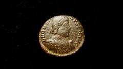 GRATIAN. 367-383 AD. NUMMUS. Siscia mint. Emperor raising female figure. +